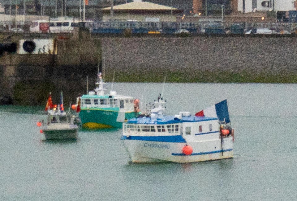 A flotilla of fishing vessels fly the French flag at St Helier harbour earlier today
