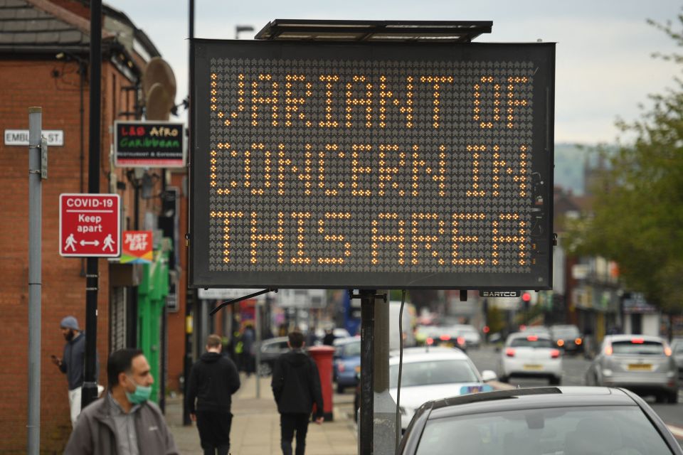 A public health digital board warns the public of a Covid-19 variant of concern in Bolton