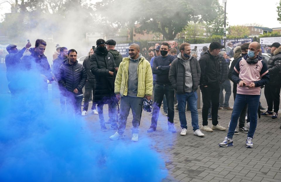 Tottenham fans set off flares outside the ground