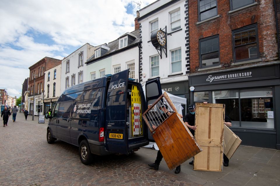Police were seen removing a number of items from the cafe including a wooden door