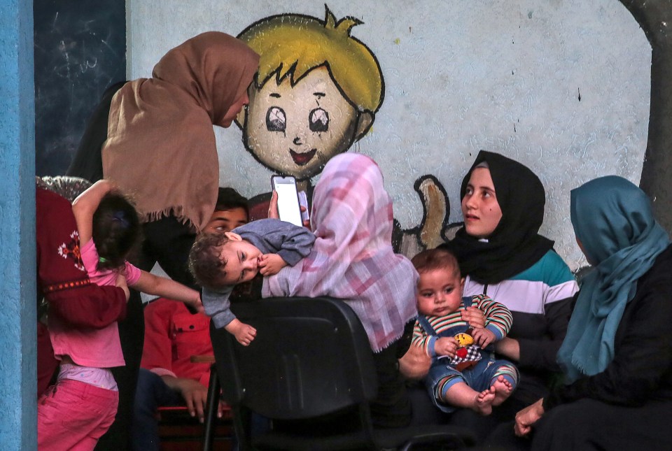 Palestinian families taking refuge at the United Nations (UN) school