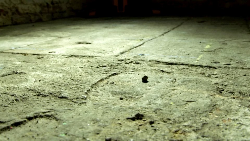 Chalk markings on the floor of the basement where police are searching for Mary's body