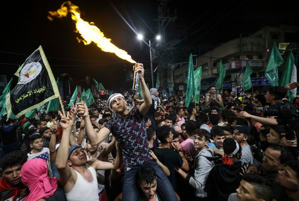 Palestinians celebrate the ceasefire brokered by Egypt between Israel and the ruling Hamas Islamic movement in Gaza City