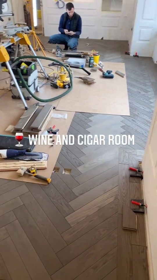 The flooring is starting to go down throughout the house, including in the wine and cigar room