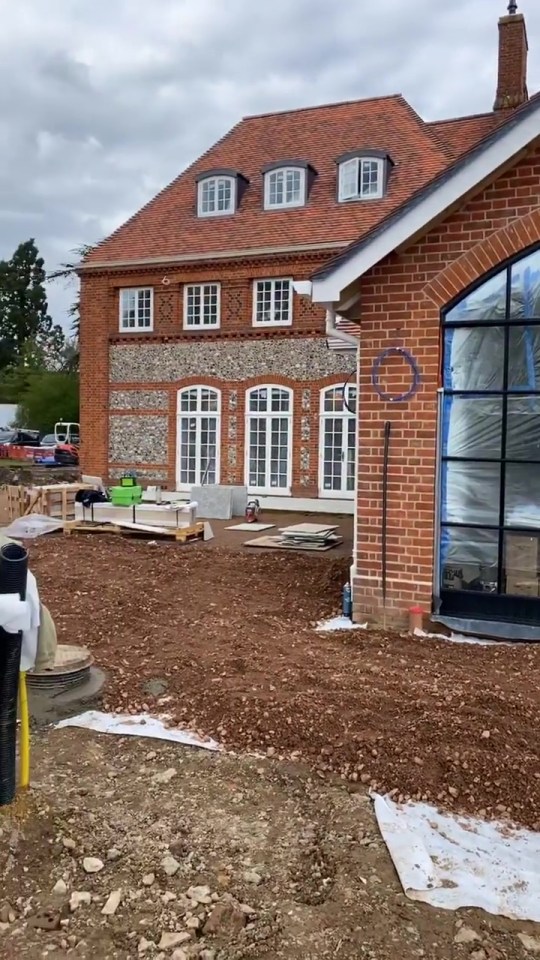 Terry shared a snap of the exterior of the home, featuring a nice combination of red brick and exposed stone