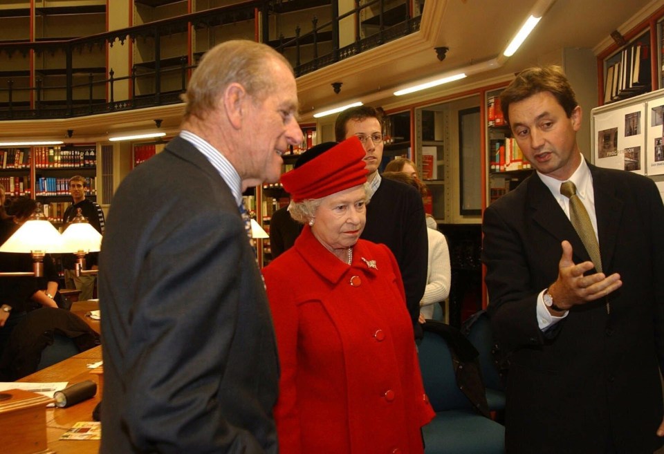 Queen Elizabeth and the Duke of Edinburgh visit the round reading room of the Maughan Library, King's College London