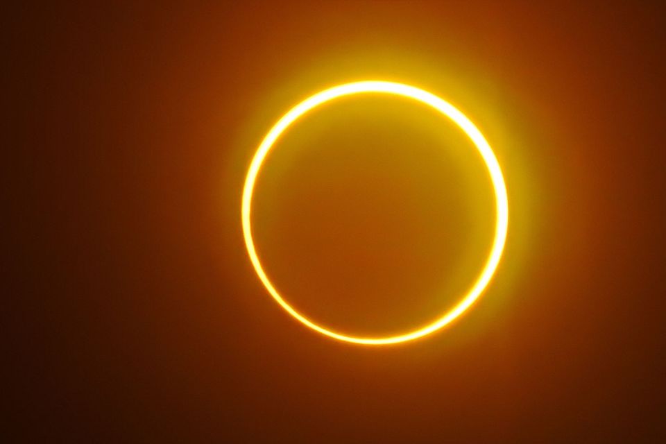 The moon moves in front of the sun in a rare 'ring of fire' solar eclipse as seen from Balut Island, Saraggani province, in the southern island of Mindanao in the Philippines on December 26, 2019.