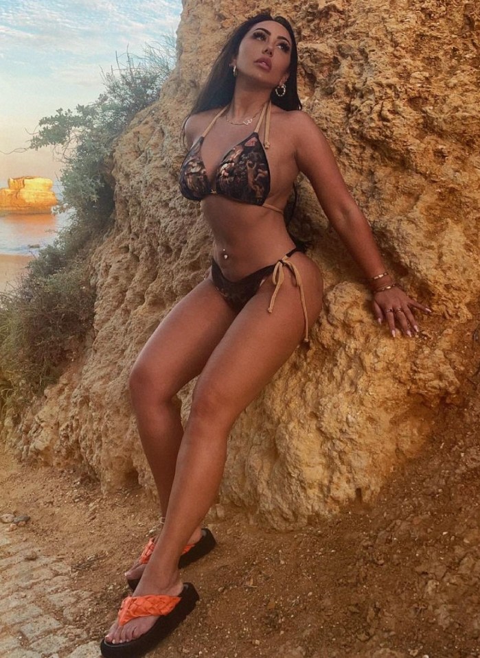 Sophie Kasaei spent the Bank Holiday posing up a storm by rocks in Portugal