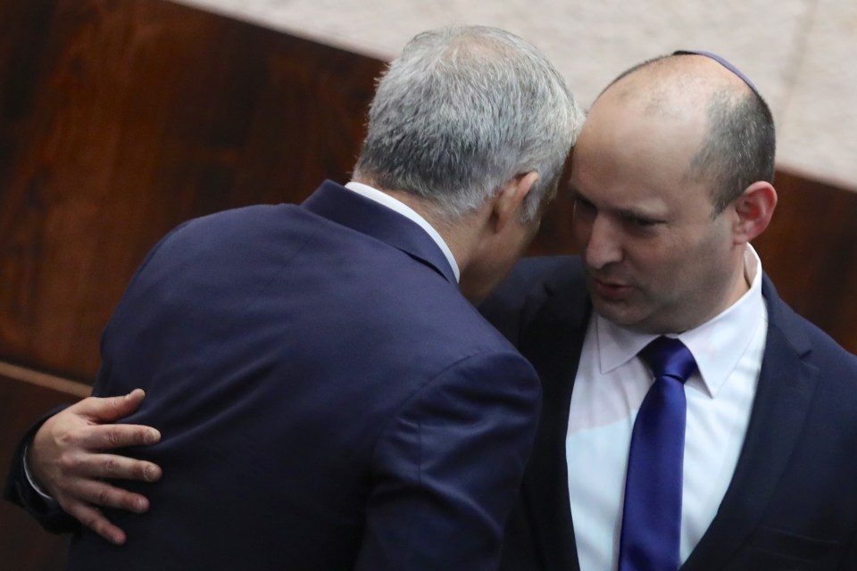 Bennett then embraced Yair Lapid