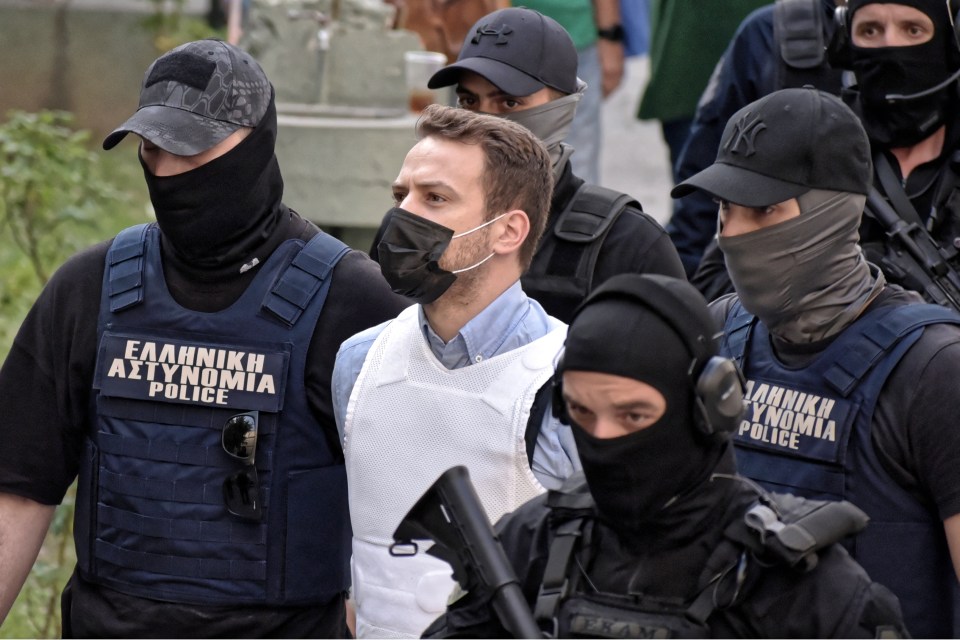 Anagnostopoulos wearing a bullet proof vest as he was led from court to jail last year