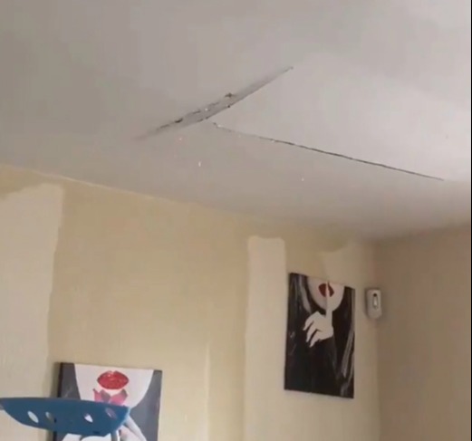 The video begins with drops of water drizzling from the roof