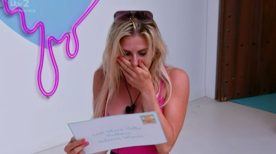 Chloe Burrows looked gob-smacked when she received the postcard