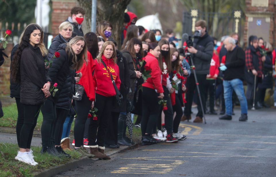 People watch the funeral procession of Olly Stephens at All Hallows Road, Reading