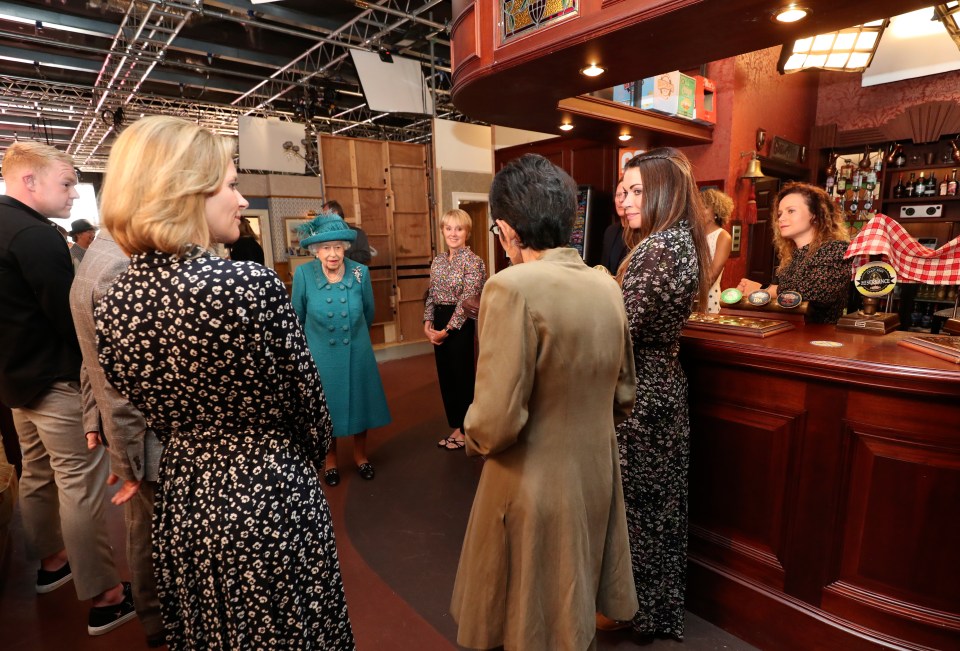 Her Majesty dropped by at the soap's pub as she visited cast and crew