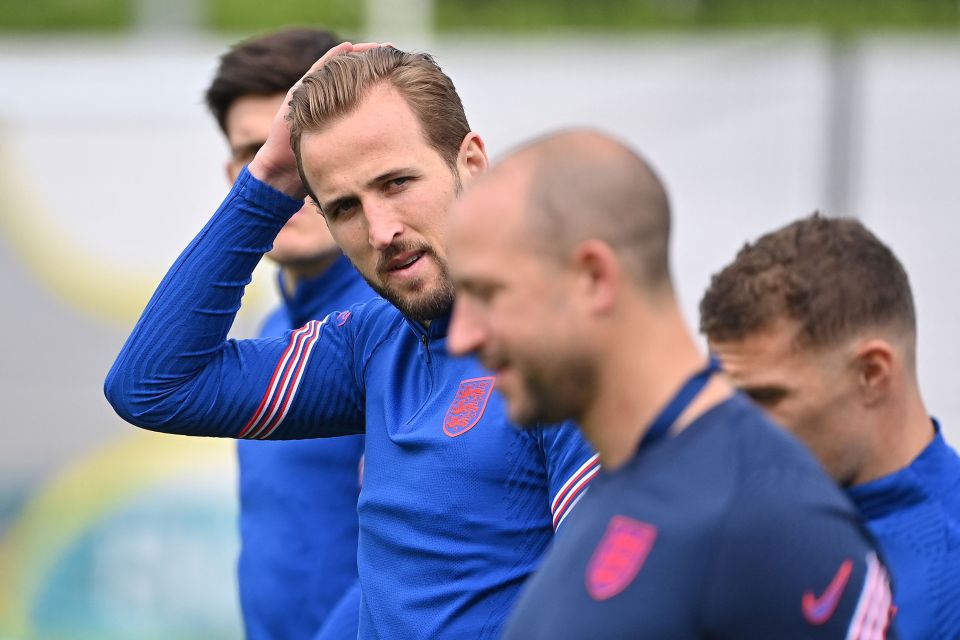 England captain Harry Kane looks on in training