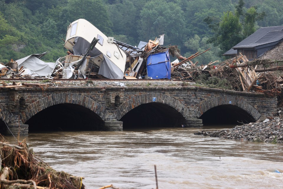 A pile of broken trees and rubbish is seen on a bridge following heavy rainfalls in Kreuzberg, Germany