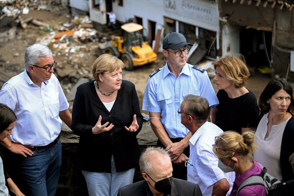 Angela Merkel inspects the damage in the village of Schuld