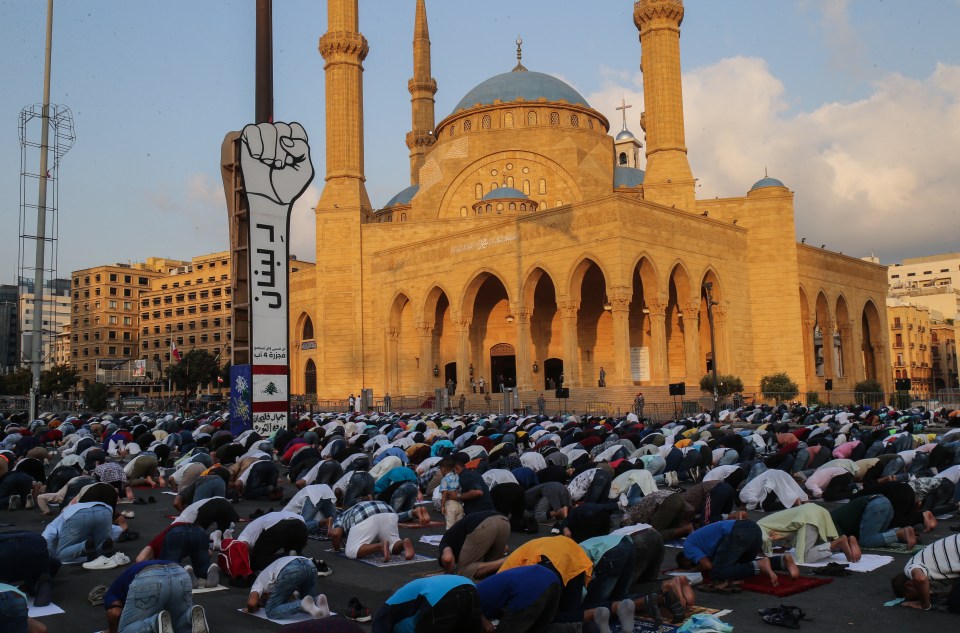 Muslims perform Eid Al-Adha prayers amid the Covid-19 pandemic in front of the Al-Ameen Mosque, in downtown Beirut, Lebanon