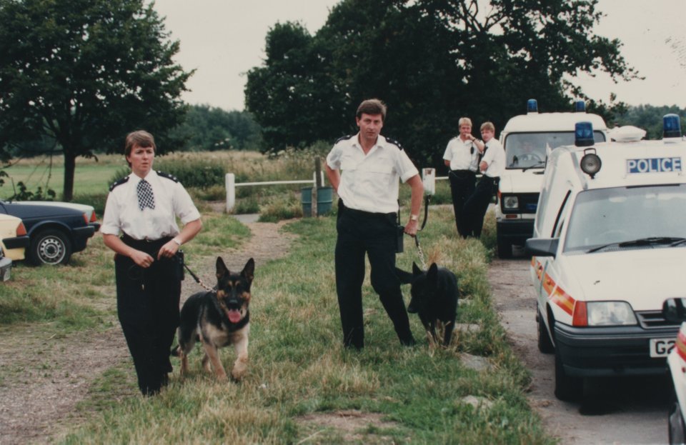 Police officers search the scene of Rachel's murder on London's Wimbledon Common