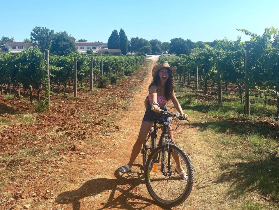 The pals spent time cycling through vineyards
