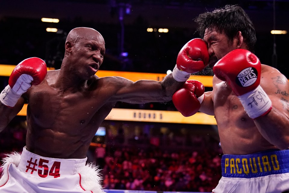 Yordenis Ugas lands a stiff jab on Manny Pacquiao