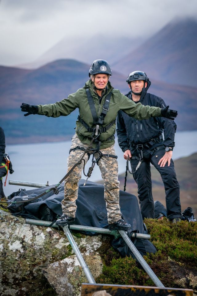 Kerry looked terrified as she balanced perilously on two poles