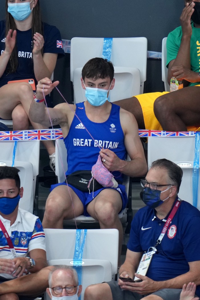 Tom Daley works on his latest knitted design inside the Aquatics Centre