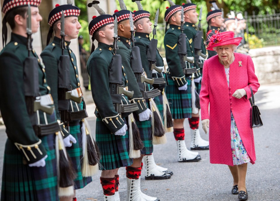 The Queen inspects a Guard of Honour at the Scottish estate