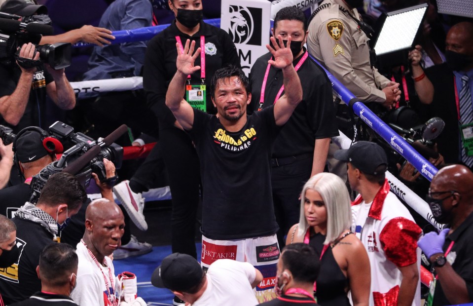 Manny Pacquiao waves to fans after his decision loss to Yordenis Ugas