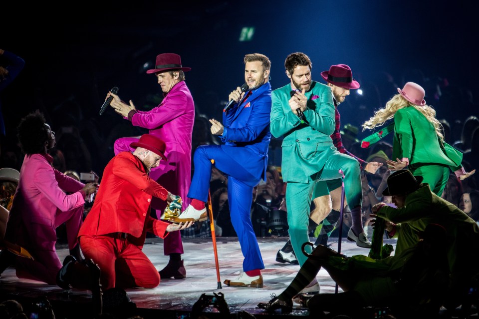 Howard performing with Take That
