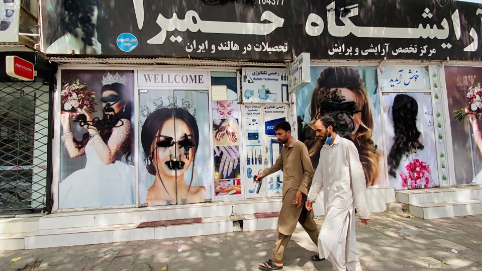 Women posters on beauty salon windows remain vandalized in Kabul