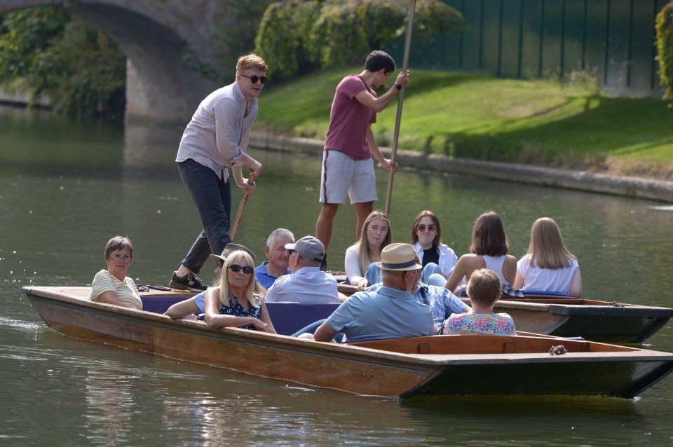 Visitors in Cambridge enjjoying a day punting on the River Cam