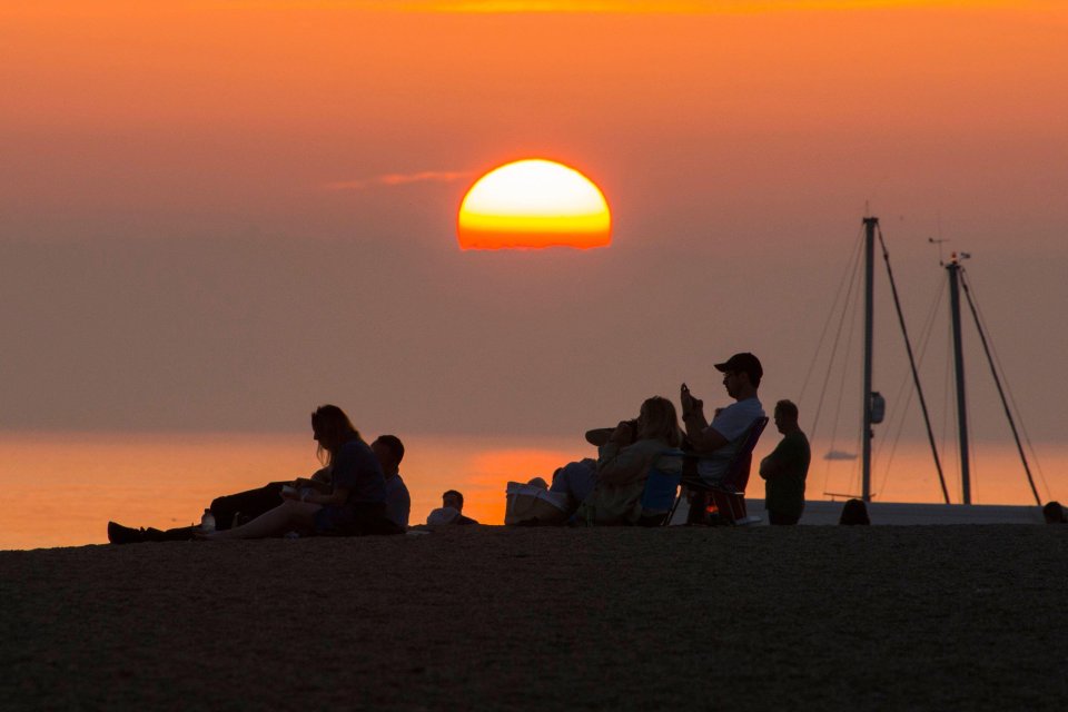 Beachgoers enjoyed the sunset in Dorset