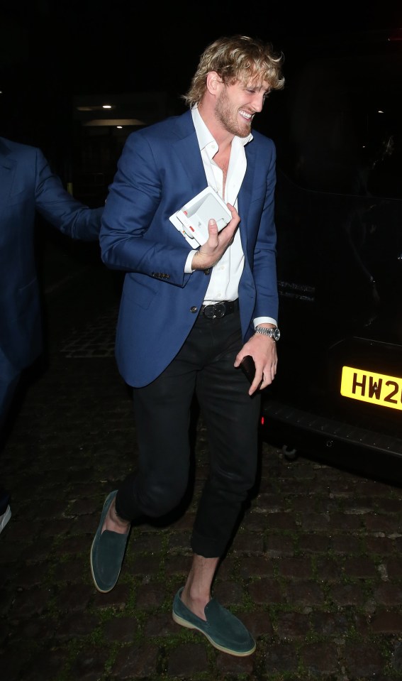 Paul looked upbeat when leaving the restaurant