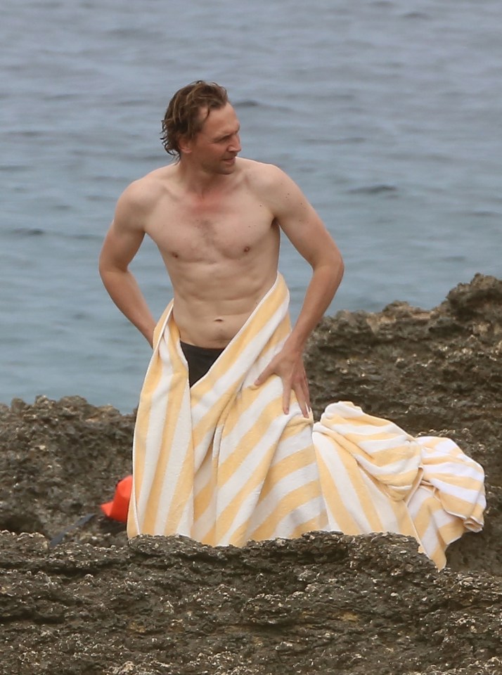 Tom put his muscles firmly on display