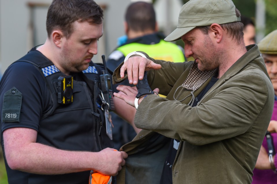 One handcuffed protester
