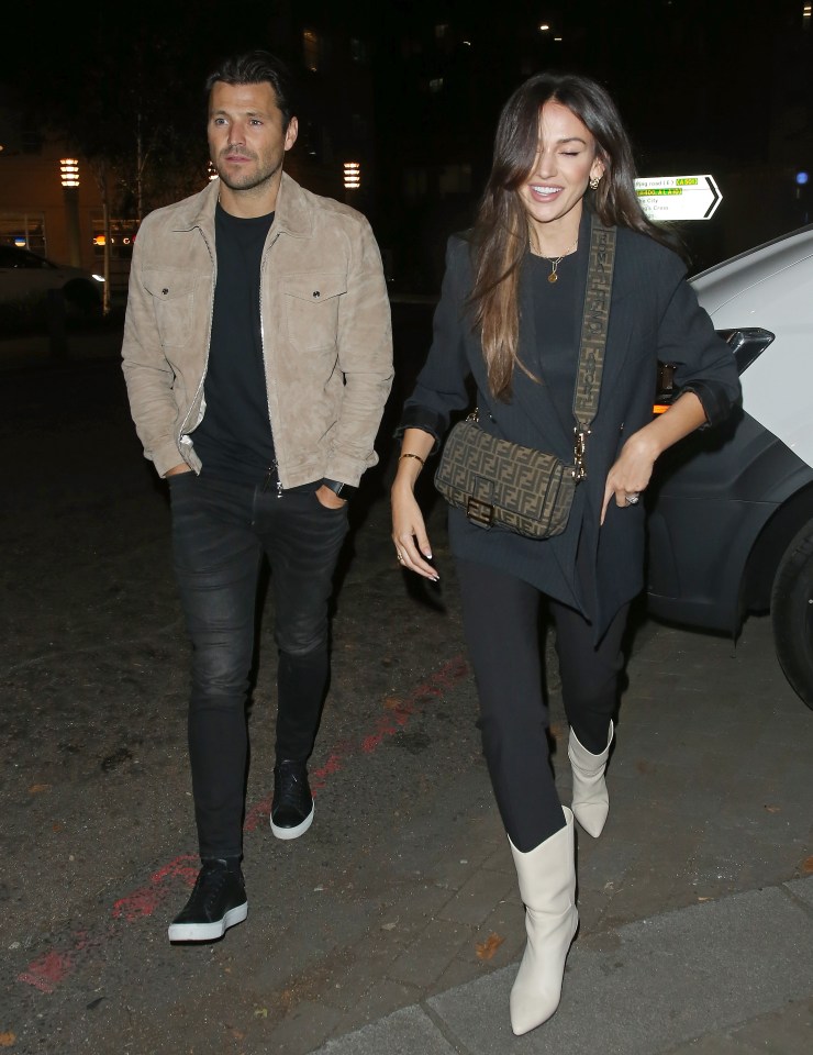 Michelle and Mark matched in black and cream outfits