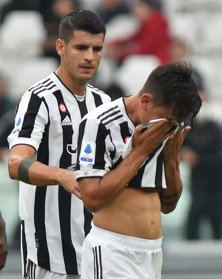 Alvaro Morata consoled Paolo Dybala as he limped off injured