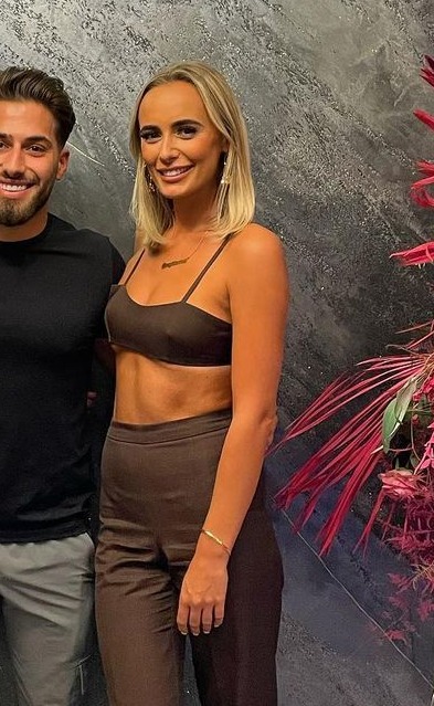Millie wowed in a chocolate brown bralet and flares