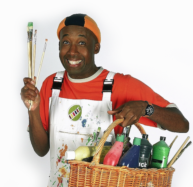 a man holding brushes and a basket of paint with the word wick on it