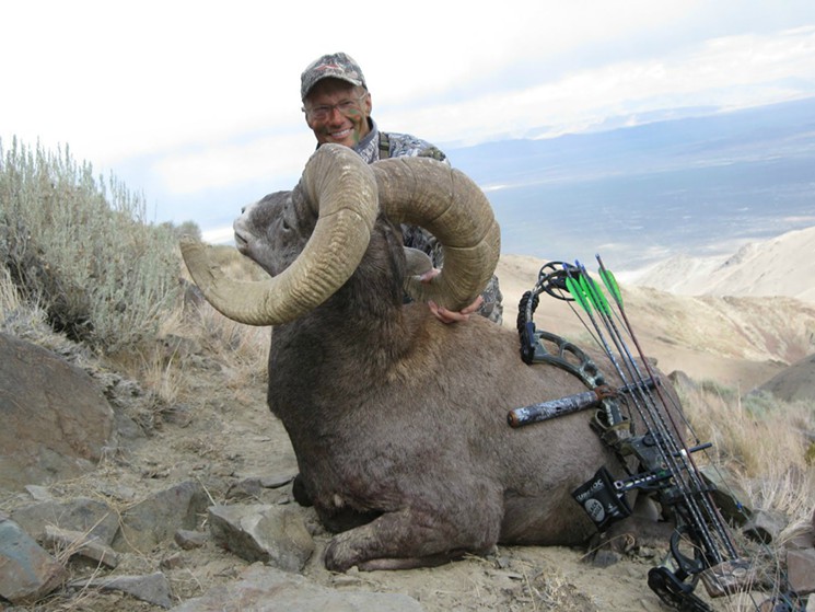 The American dentist pictured with a dead Altai argali - the world's biggest type of sheep