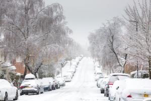  A snow-covered street with no moving traffic in the North London suburb of Muswell Hill
