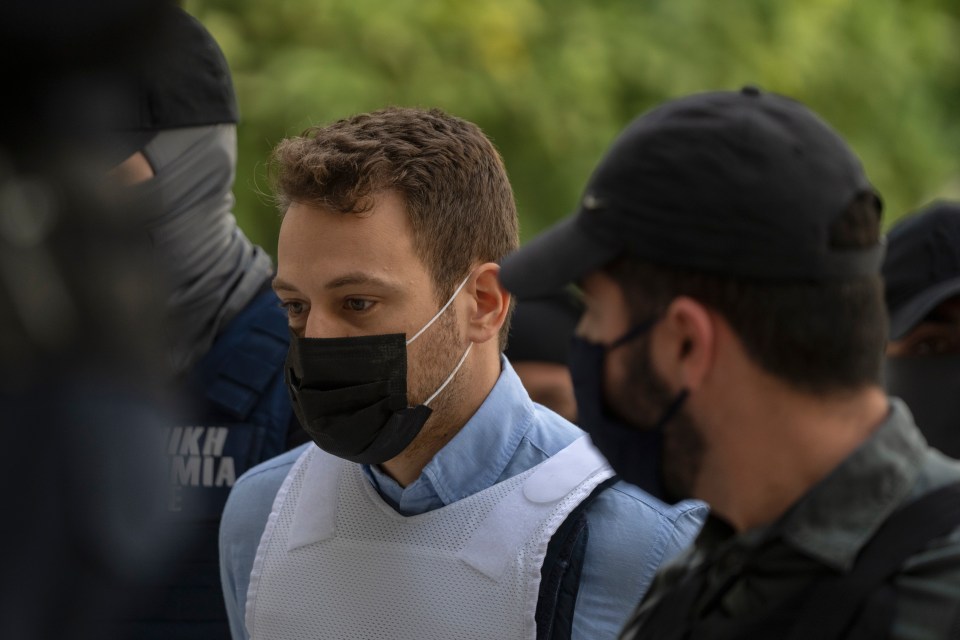 Anagnostopoulos being escorted to court by armed guards