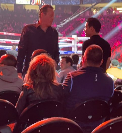 A fan took a quick photo of movie star Vince Vaughn taking his seat