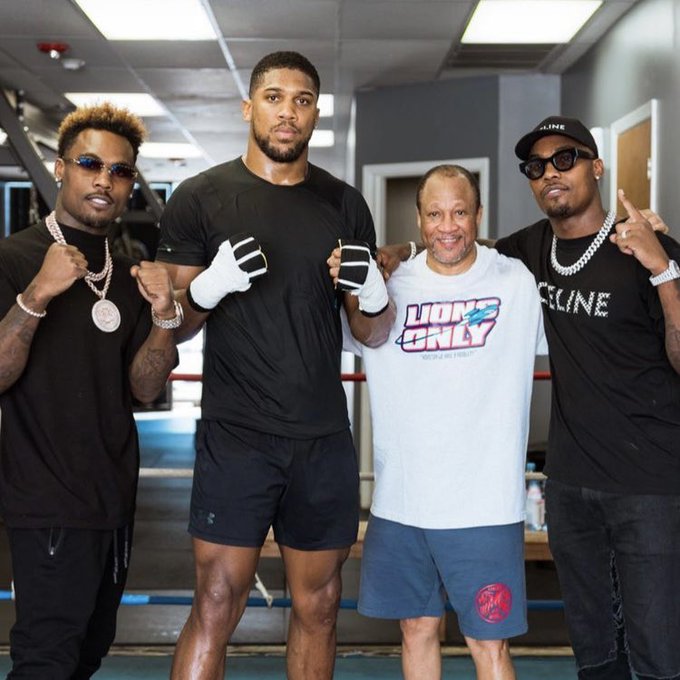 Anthony Joshua pictured with the Charlo brothers and coach Ronnie Shields  in Texas