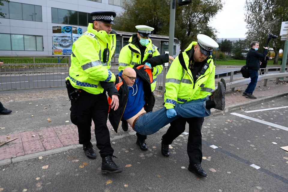 Police arrested protesters after they blocked the road