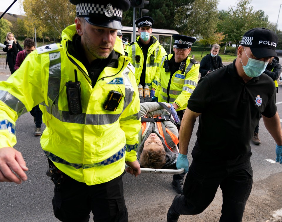 One protester was lead away on a stretcher today