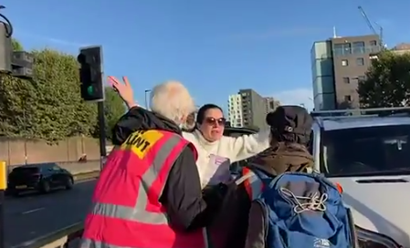 One woman could seen desperately yelling at Insulate Britain activists