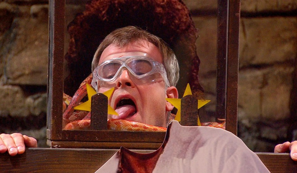 Simon's tongue makes contact with a snake as he tries to spin stars and win meals for his camp