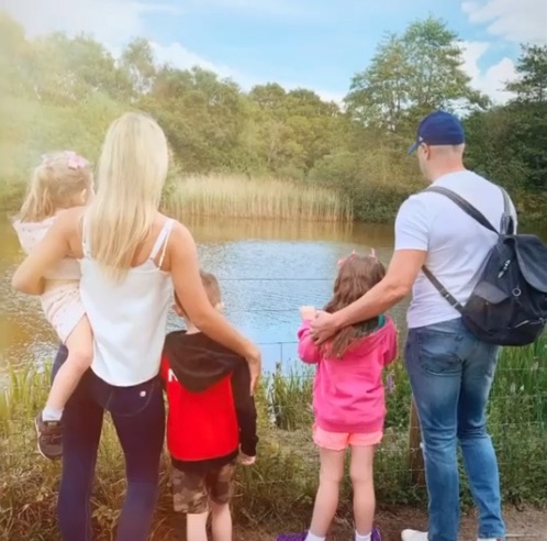 The couple pictured with their kids Penelope, Leo and little Felicity